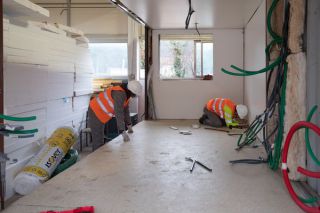 Building a wall inside shipping container.jpg