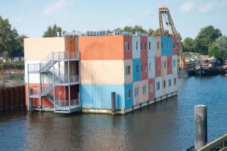 A floating container housing community
